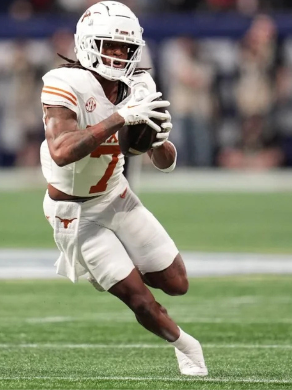 Isaiah Bond of Texas running with the football during a game
