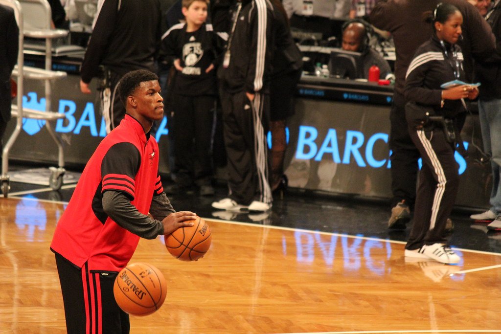 Jimmy Butler driving to the basket during a Miami Heat game in 2025.